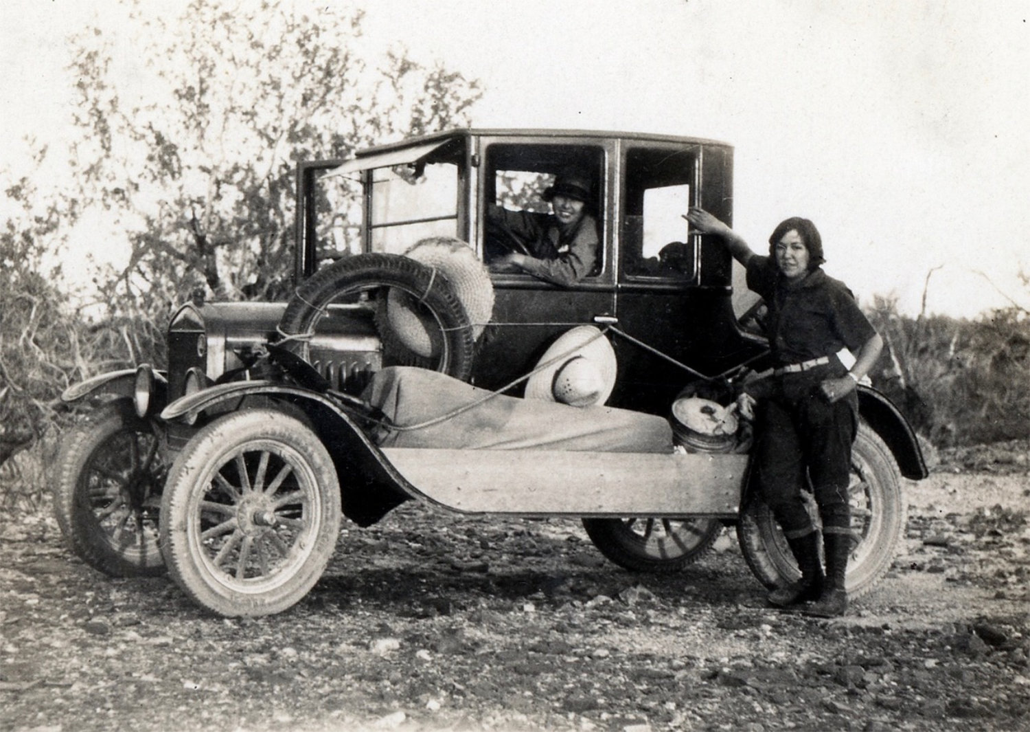 Susie Keef Smith (seated in car) and Lula Mae Graves drove much of the Bradshaw Trail in Susie's Model T in 1930.</b> <br>Unknown photographer. Warner Graves Collection.
